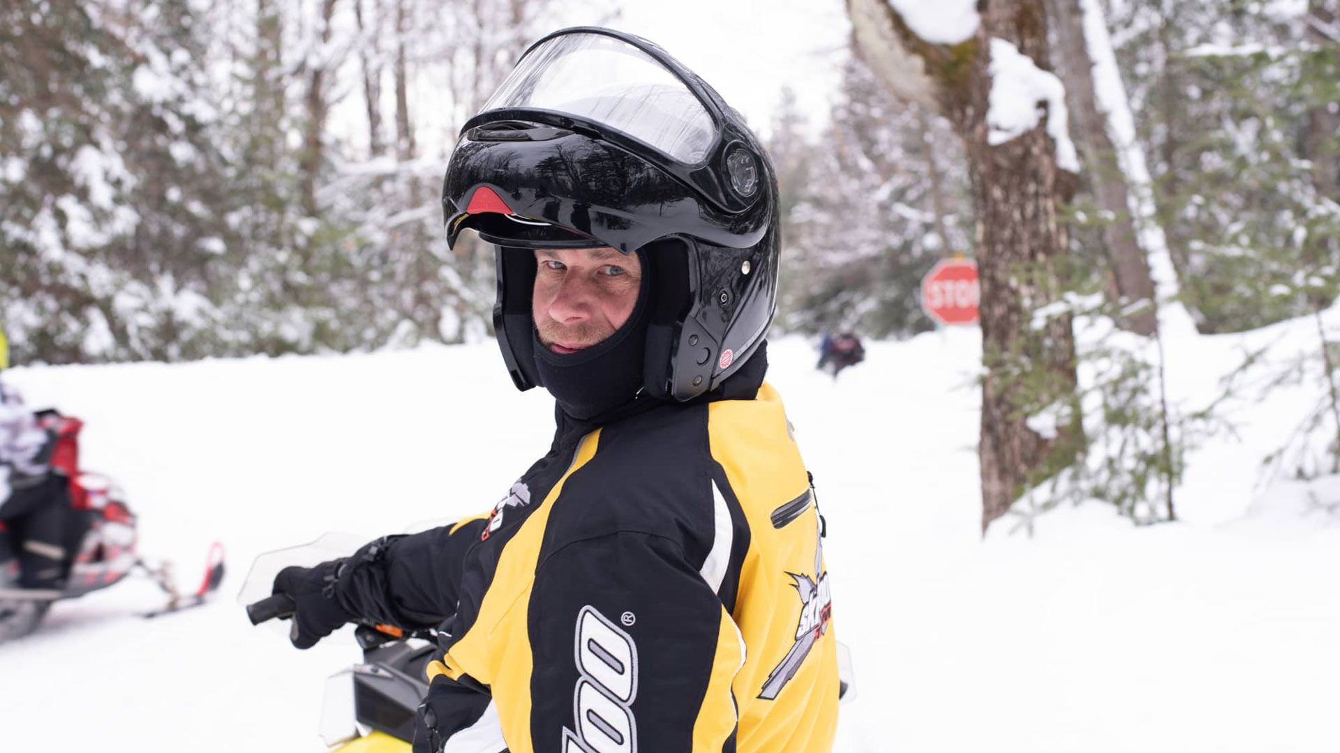 Man on snowmobile looking at camera Vilas County Wisconsin