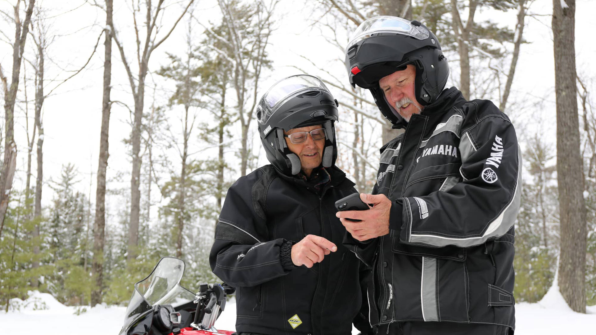 Snowmobilers using the Vilas County trails app in winter